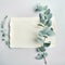 Botanical mockup Eucalyptus leaves set alongside customizable blank paper