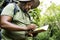 Botanist making notes in his notepad