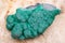 Botryoidal Malachite cluster from Democratic Republic of the Congo on Natural Polished Petrified wood slab