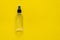 Bottle of antiseptic, a bottle of hand sanitizer, hand sanitizer spray on a yellow background, for the prevention of