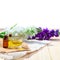 Bottle of aroma essential oil or spa and natural fragrance oil with flower on wooden table