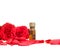 Bottle of aromatherapy oil and roses