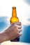 Bottle of beer. Natural background. Man handÂ´s keep a bottle of beer. Alcohol drink.