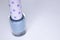 A bottle with blue nail polish on white background. nail lacquer. Nail manicure concept. , copy space