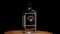 Bottle of Brennivin on black background. Traditional Icelandic alcoholic drink. The camera flies around. Parallax effect