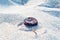 Bottle caps on a beach to illustrate waste and mass tourism in tourist areas and beaches