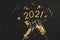 A bottle of champagne, Figures 2021. Christmas or New Year background, plain composition made of Xmas decorations and