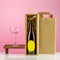 Bottle of champaign with wine glass and bottles of wine in paper bag