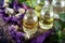 A bottle of common mallow essential oil with dried flowers. Dried herbs with essential oils for aromatherapy treatment