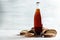 Bottle of delicious fresh kvass, spikelets and bread on white wooden table.