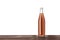 Bottle of delicious kvass on wooden table against white background