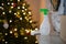 A bottle of detergent and rag on the background of New Year`s lights.