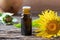 A bottle of elecampane essential oil with fresh plant