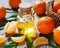 Bottle of essential citrus oil and ripe tangerines with leaves