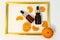 A bottle of essential oil, Aromatic tangerine oil in a dark bubble, cosmetic oil from tangerine. Bottles with sweet orange essenti