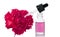 Bottle of flower essential oil with fresh carnation flowers