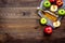 Bottle of fresh cider near autumn apples. Dark wooden background top view space for text