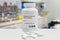 Bottle of generic Remdesivir Antiviral tablets 200 mg over blurry laboratory background. artistic rendering. Generic barcode
