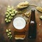 Bottle and Glass beer with Brewing ingredients. Hop flower with wheat. Top view. Copy space. Still life. Flat lay