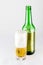 Bottle and glass of beer on a white background. Large malt cold drink.