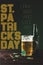 Bottle and glass of beer on wooden tabletop with st patricks day lettering