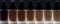 Bottle glass different color tone liquid tonal foundation makeup decorative cosmetic natural cream black background back light