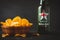 Bottle of Heineken beer for England fan with bowl of crispy chips on the black background. Euro 2020 - 2021 football tournament