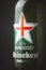 Bottle of Heineken beer for the fan of England on the black background. Macro shot. Euro 2020 - 2021 football tournament