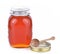 Bottle honey,spoon on white background