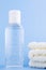 Bottle of instant antiseptic hand sanitizer transparent gel isolated on blue background, no label. Antibacterial, hydro alcoholic