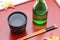 Bottle of Japanese shochu and bowl on wooden tray