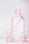 Bottle with lotion, tonic or micellar cleansing water , natural cosmetic product or beauty concept on pastel background