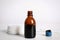 Bottle of medical iodine, cotton pads and buds on white wooden table