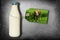 Bottle Of Milk With Label - Dairy Cow On Meadow - Isolated On Slate