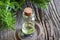 A bottle of mountain savory essential oil with fresh mountain sa