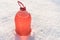 Bottle with non-freezing windshield washer fluid, snow background