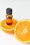 Bottle of orange fruit essential oil. Aromatherapy treatment. Naturopathic medicine