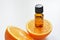 Bottle of orange fruit essential oil. Aromatherapy treatment. Naturopathic medicine. Copy space