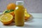 Bottle of orange juice studio shot orange organic freshly squeezed juice in a small plastic bottle on a colorful