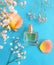 Bottle perfume beautiful product trendy scent   fragrance atomizer flower on a colored background