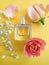 Bottle perfume beautiful product trendy  springtime scent   fragrance atomizer flower on a colored background