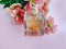 Bottle perfume care aromatic elegant container beautiful bloom flower on a