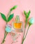 Bottle perfume  essence    glass    aromatic  product elegance creative atomizer fragrant on a colored background springtime