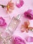 bottle perfume flower fragrance on a colored background aromatherapy springtime
