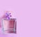 Bottle perfume flower lilac on a colored background