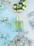 Bottle perfume flower trendy  colored background springtime  beautiful