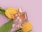 Bottle perfume flower tulip elegant  container elegance    styling   on colored background aroma