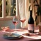 A bottle of pink wine and glasses grace the table. Bathed in the gentle sunrays, the scene embodies modern elegance and simplicity
