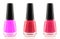 Bottle red and pink nail polishes isolated