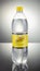 Bottle of Schweppes Indian tonic drink isolated gradient background.